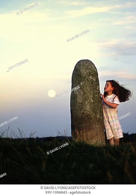 The Lia Fail, crowning stone of the high kings of Ireland, full moon rising  Ancient ritual site of Tara, County Meath, Ireland