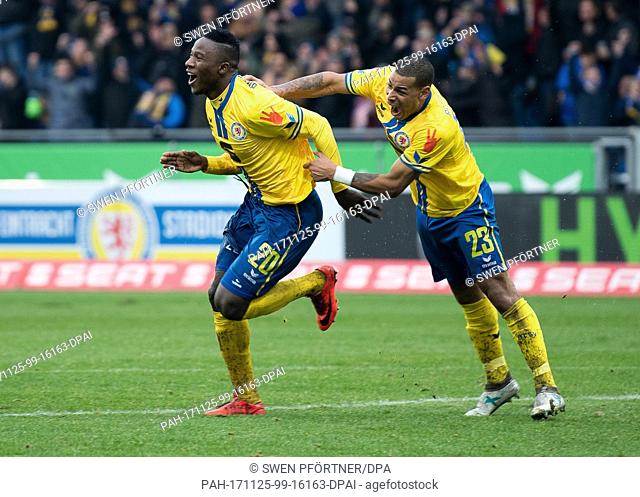 Braunschweig's scorer Suleiman Abdullahi (l) and Onel Hernandez celebrate the 2:1 goal during the 2nd German Bundesliga soccer match between Eintracht...