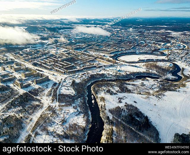 Russia, Leningrad Region, Tikhvin, Aerial view of Tikhvinka river and city in Winter