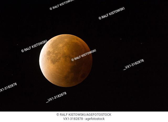 Lunar Eclipse, Red supermoon, Blood moon, red orange full moon with sparkling stars, 28th September 2015