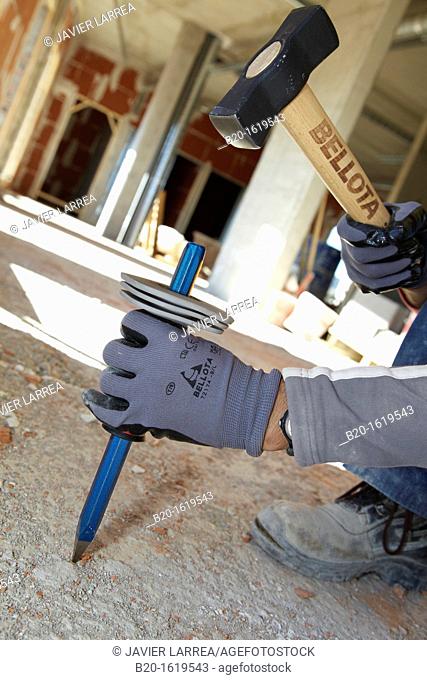 Construction worker with sledgehammer and pointer, Building hand tool, Donostia, San Sebastian, Gipuzkoa, Basque Country, Spain