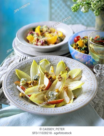 Chicory salad, with tabbouleh with oranges and bean salad in the background