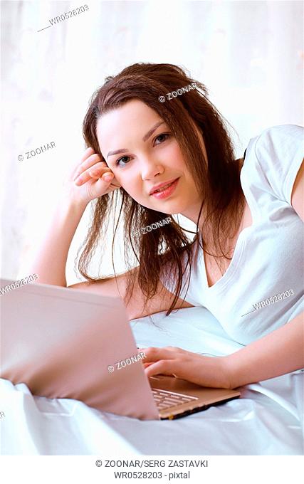 relaxing girl with laptop