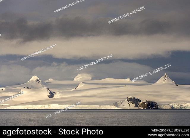 View from Yankee Harbor in the South Shetland Islands off the coast of Antarctica, of Livingston Island emerging out of clouds