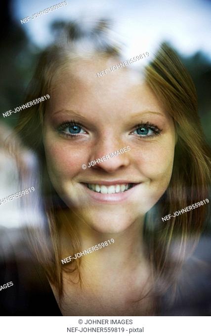 A girl looking through a window, Sweden