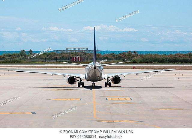 A plane is ready for departure at the airport of Barcelona in Spain