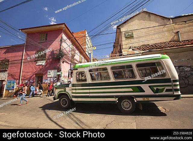 Colorful local bus near Sagarnaga street at the historic center, La Paz, Bolivia, South America