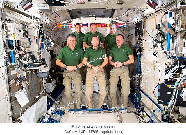 The six-member Expedition 53 crew poses inside the shirt-sleeve environment of the Japanese Kibo laboratory module. In the front row (from left) are European...