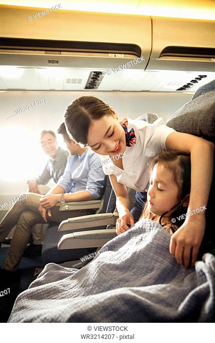 Flight attendants and passengers on the plane