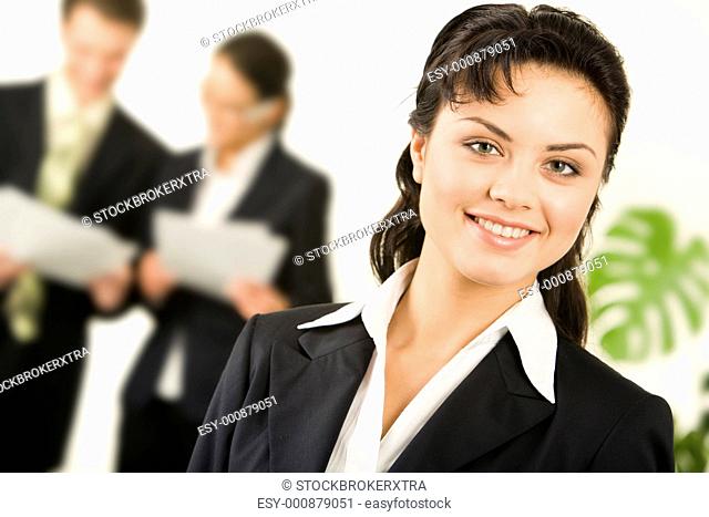 Portrait of successful businesswoman in working environment in office