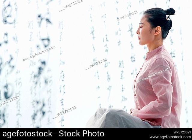 Young woman sitting meditation