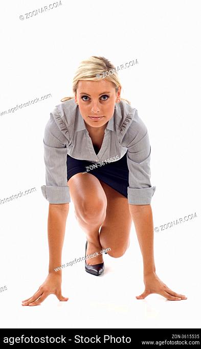 Businesswoman getting ready for race isolated over white