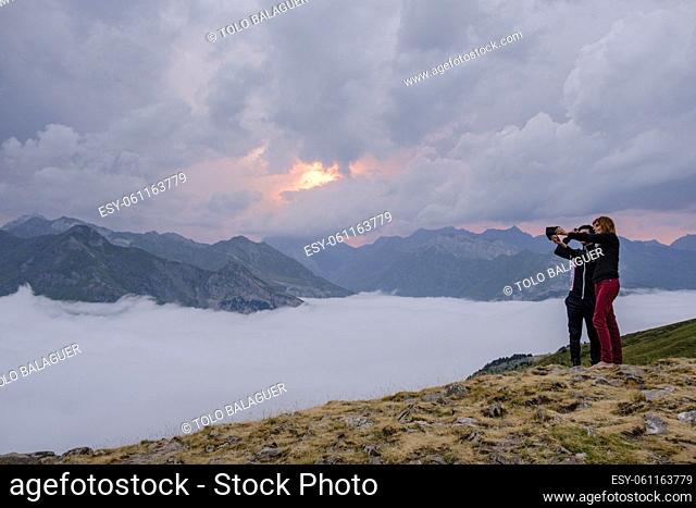 couple taking a selfie, Cirque de Gavarnie from Espuguettes refuge, Pyrenees National Park, Hautes-Pyrenees, France