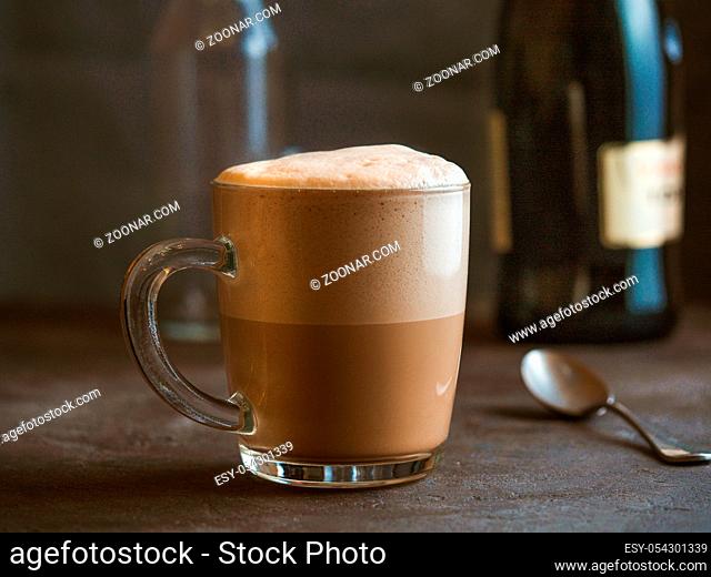 Coffee steamed with cream, Raf coffee, delicious popular drink. Glass cup of raf coffee beverage in coffee house or bar counter