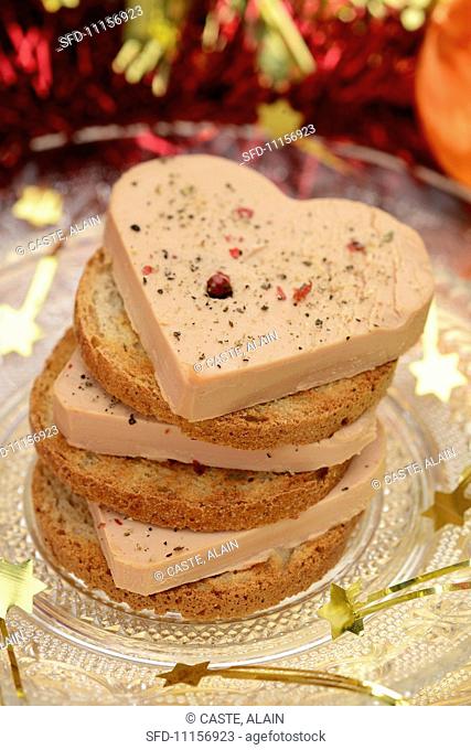 A stack of foie gras and toasted slices of bread