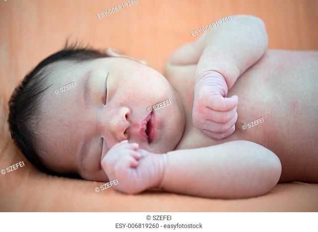 Newborn Asian baby girl sleeping, 7 days after birth