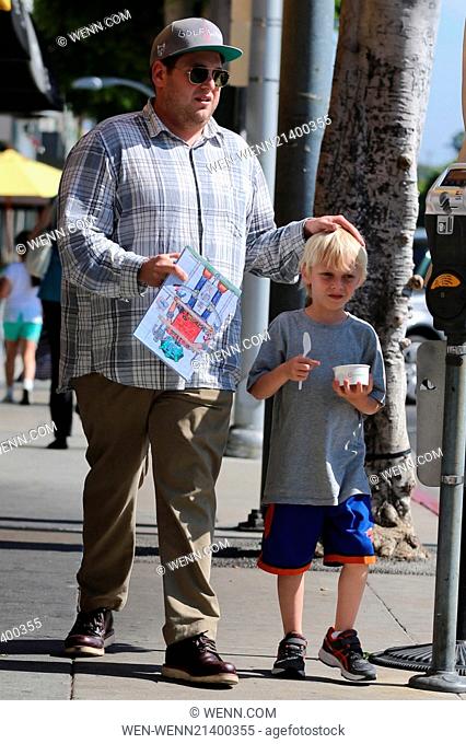 Jonah Hill takes one of his nephews out for frozen yogurt in Beverly Hills. Hill carries the tots coloring book while heading back to the car