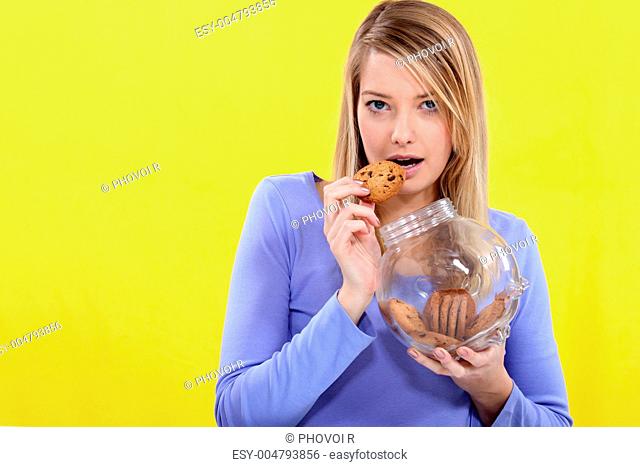 Cute blond eating cookies