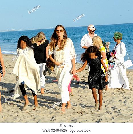 Mel B and Heidi Klum enjoy a day at the beach with their daughters in Malibu, California. The 'America's Got Talent' duo were seen drinking wine at Nobu before...