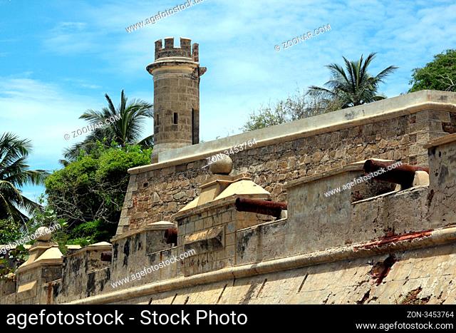Fortress and palm trees on the coast in Pampatar