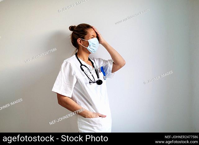 Female doctor wearing protective face mask