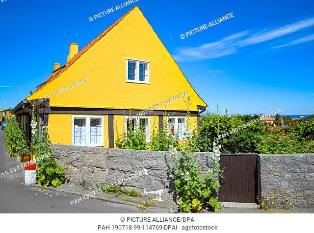 28 June 2019, Denmark, Svaneke: A typical residential house in Svaneke, a small town on the north-eastern edge of the Danish Baltic island of Bornholm