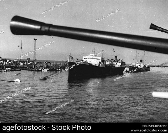 Merchant shipping gin Port Said Harbour, where they been berthed by R.N. personnel after passing through the Suez Canal.Since the middle of October