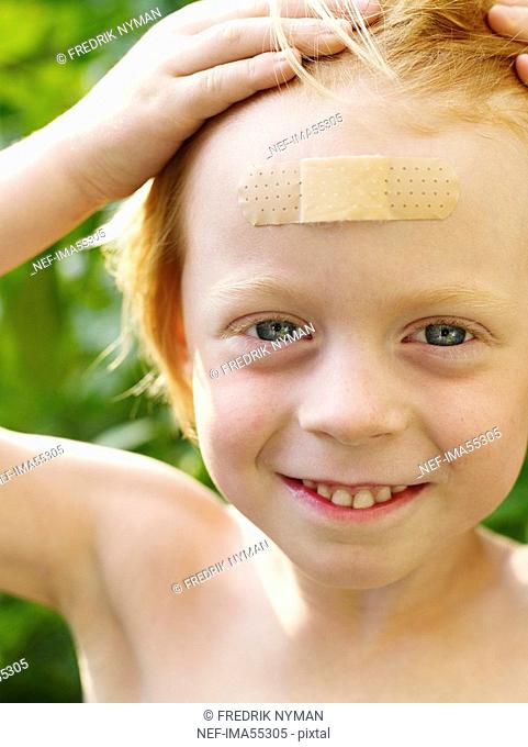 A boy with a plaster on his forehead Sweden