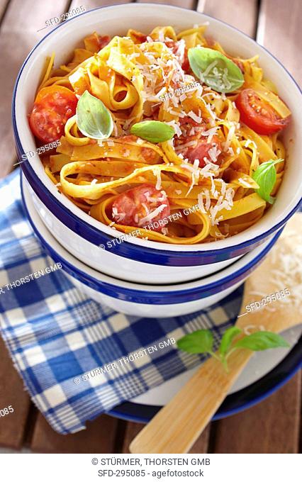 Tagliatelle with cherry tomatoes, basil and grated cheese