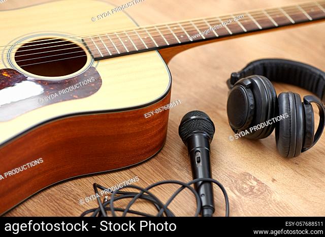 close up of guitar, microphone and headphones