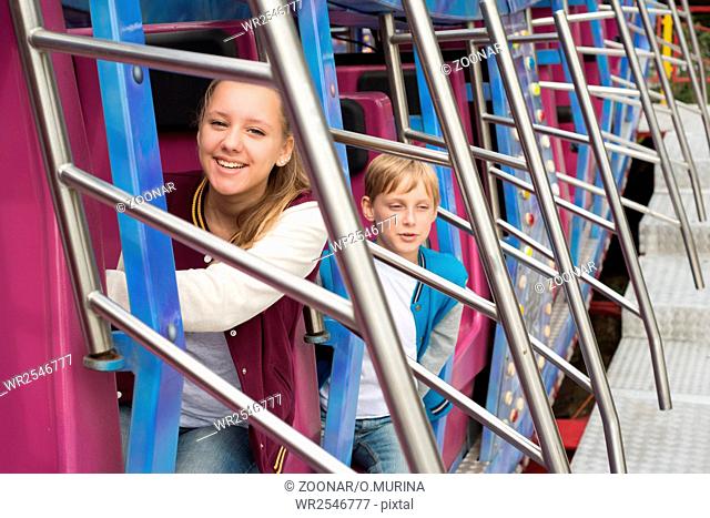 Teens Ride on the Carousel