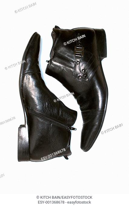 Leather boots isolated against a white background