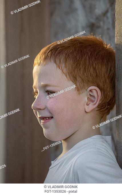 Close-up of cute boy looking away