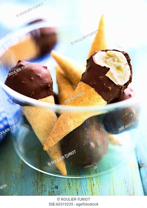 Mini vanilla ice cream cones coated in chocolate and Amaretto crumbs