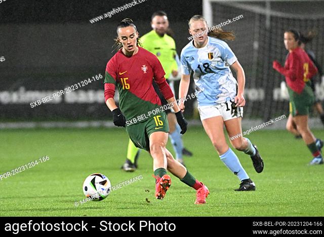 Daniela Areia Santos of Portugal battles for the ball with Lore Nuyens of Belgium during a friendly soccer game between the national women under 23 teams of...
