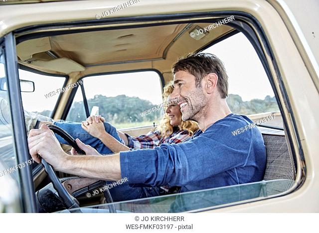 Smiling couple in pick up truck