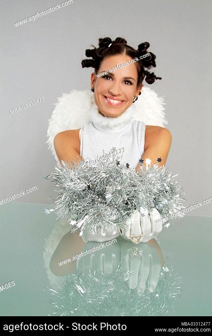 Young woman dressed as Christmas angel
