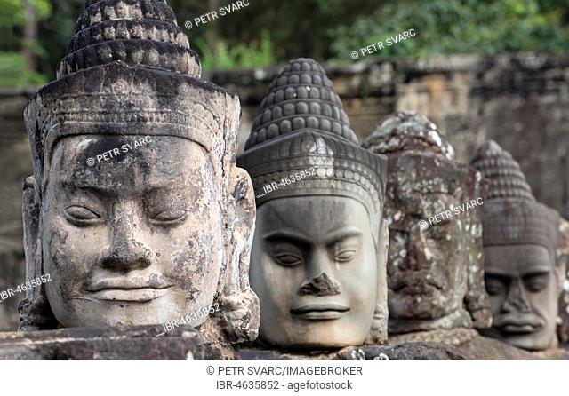 Faces of god statues on the balustrade of the South Gate causeway, Angkor Thom, Cambodia