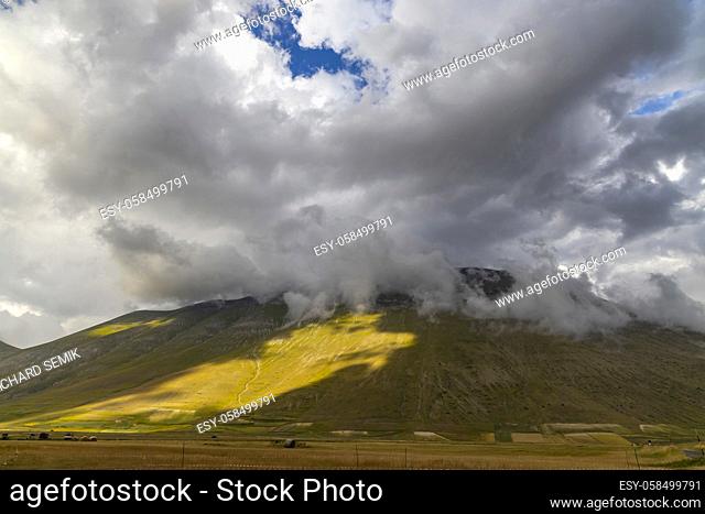 Dramatic mountain landscape near Castelluccio village in National Park Monte Sibillini, Umbria region, Italy