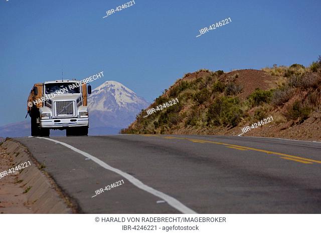 Truck on the road in front of the Sajama volcano, Altiplano, border to Bolivia, Chile