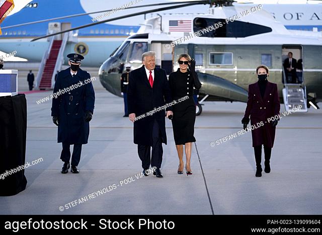 U.S. President Donald Trump, second left, and U.S. First Lady Melania Trump, second right, arrive to a farewell ceremony at Joint Base Andrews, Maryland, U