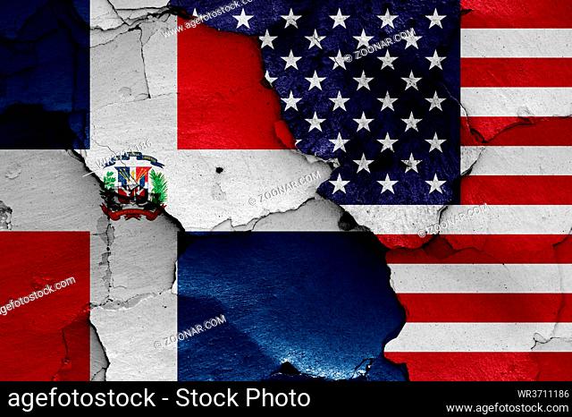 flags of Dominican Republic and USA painted on cracked wall