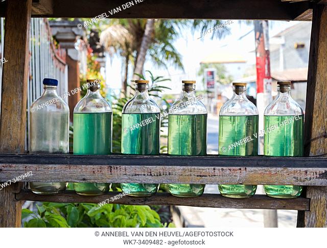 Gasolina in bottles for sale on bali Indonesia, petrol at local station close-up