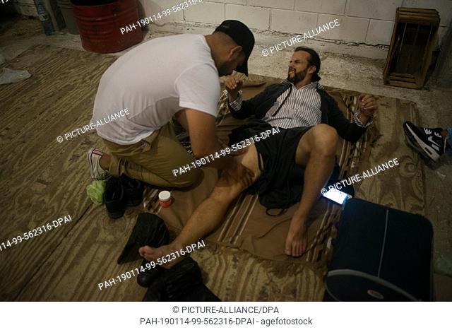 14 January 2019, Argentina, Laborde: A candidate's leg is massaged before a training session in the 52nd Malambo Competition