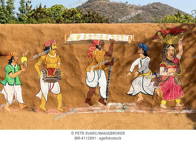 Traditional painting on a clay wall in rural Rajasthan, Shilpgram Crafts Village near Udaipur, Rajasthan, India