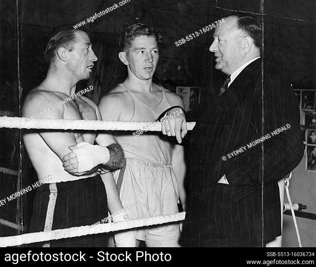 Australian Boxer Brothers-in-Law in England For Series of Fights. Jack Solomons talking to Eddie Miller (left) and Terry O'Toole (centre) at his gymnasium