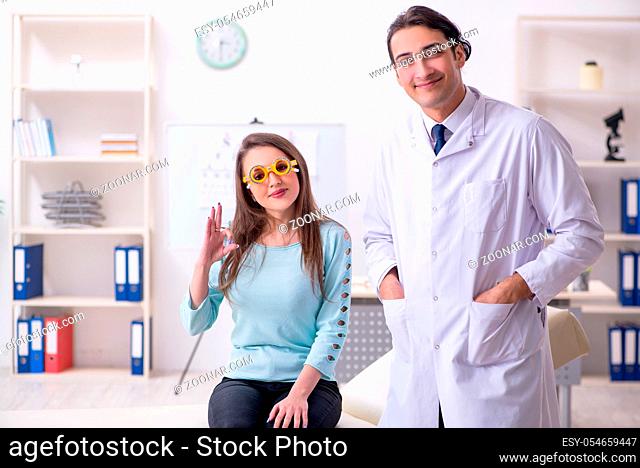 The young woman visiting male doctor oculist
