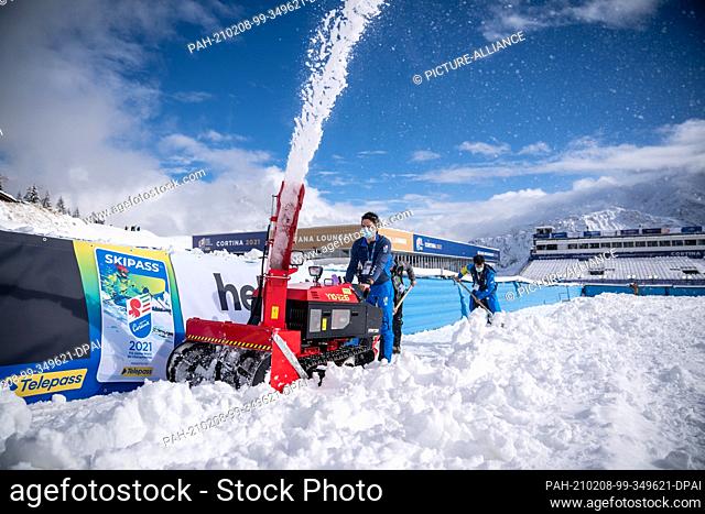 08 February 2021, Italy, Cortina d'Ampezzo: Alpine skiing: World Championships: The fresh snow is transported out of the finish area with a snow blower