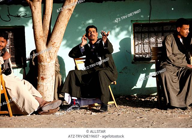 MUSLIM MAN ON TELEPHONE; NAGAA EL-SHAIKH ABOU AZOUZ, EGYPT; 07/01/2013
