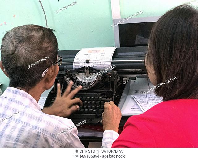 The 70-year old Mg Mg Than works at his typewriter in Yangon, Myanmar, 10 February 2017. In the ""Notary District"", around two dozen men and women fill out...